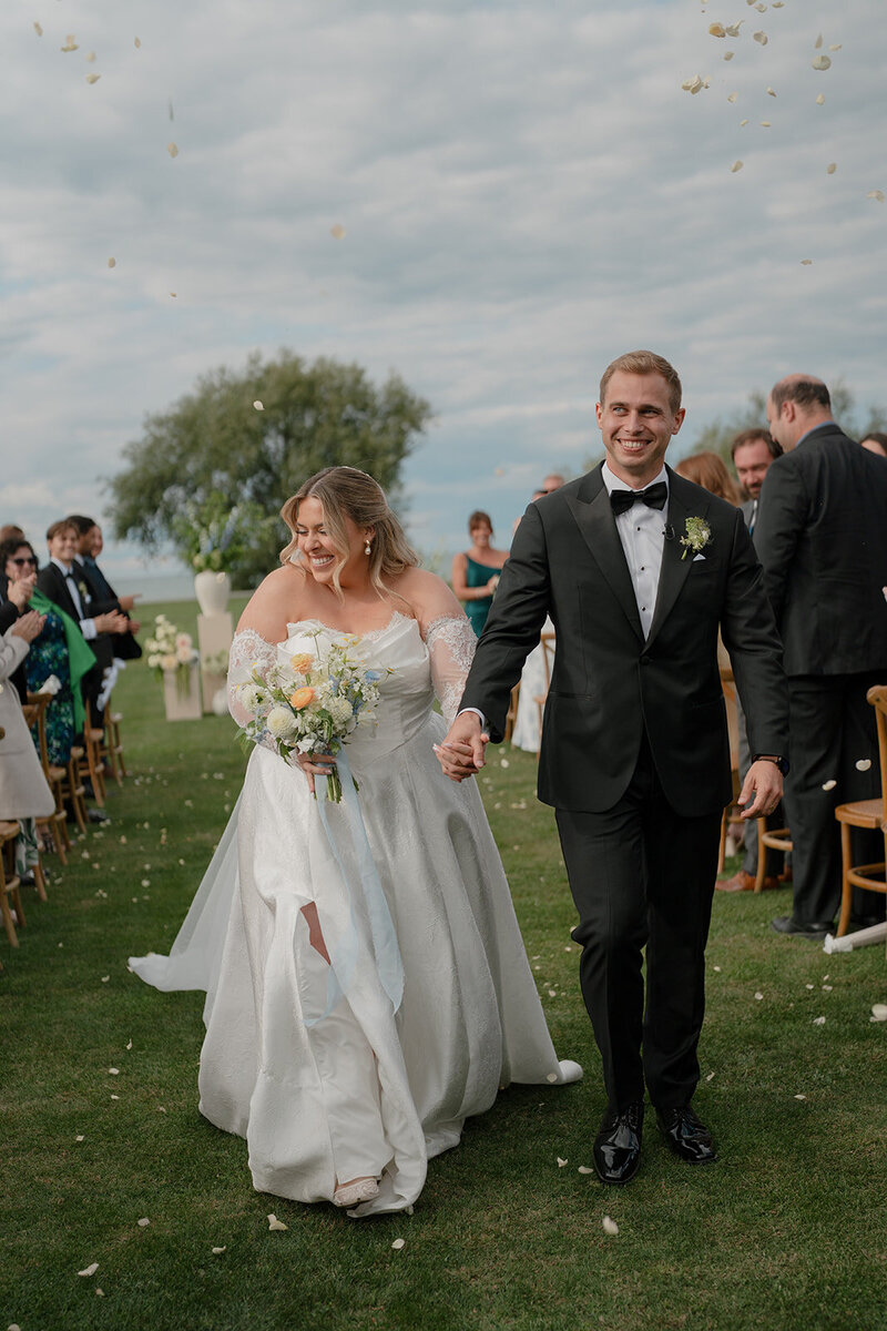 Long table decorated with candles and flowers for social event