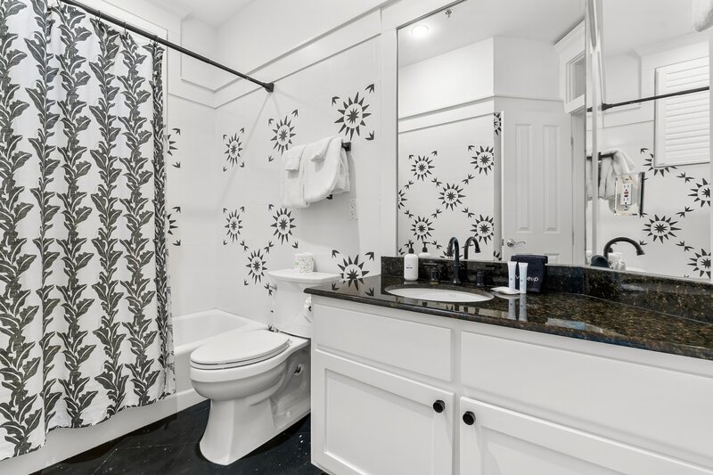 Modern Bathroom with Black and White Tile Design - Panama City Beach Vacation Rental