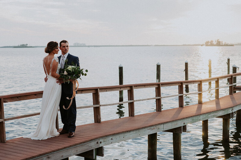 Bride and Groom on the dock at Beso Del Sol in Clearwater, Florida