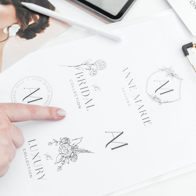 Close-up of textured paper featuring Anne-Marie Designs floral branding