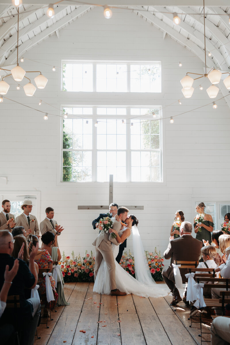 man and woman dancing at wedding
