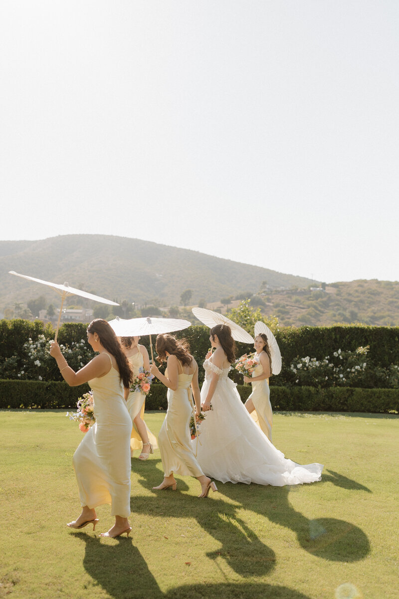 Bridesmaids walking at twin oaks san marcos