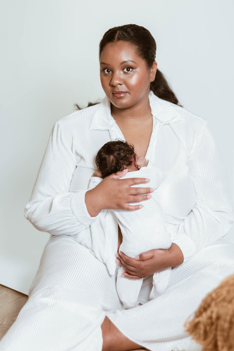 mother holding newborn baby photography