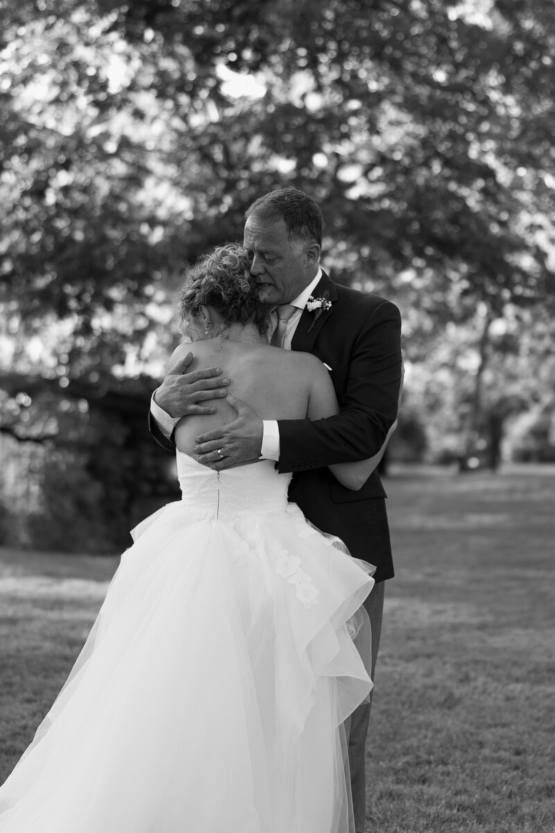 bride and groom dancing under twinkling lights at a Tacoma wedding