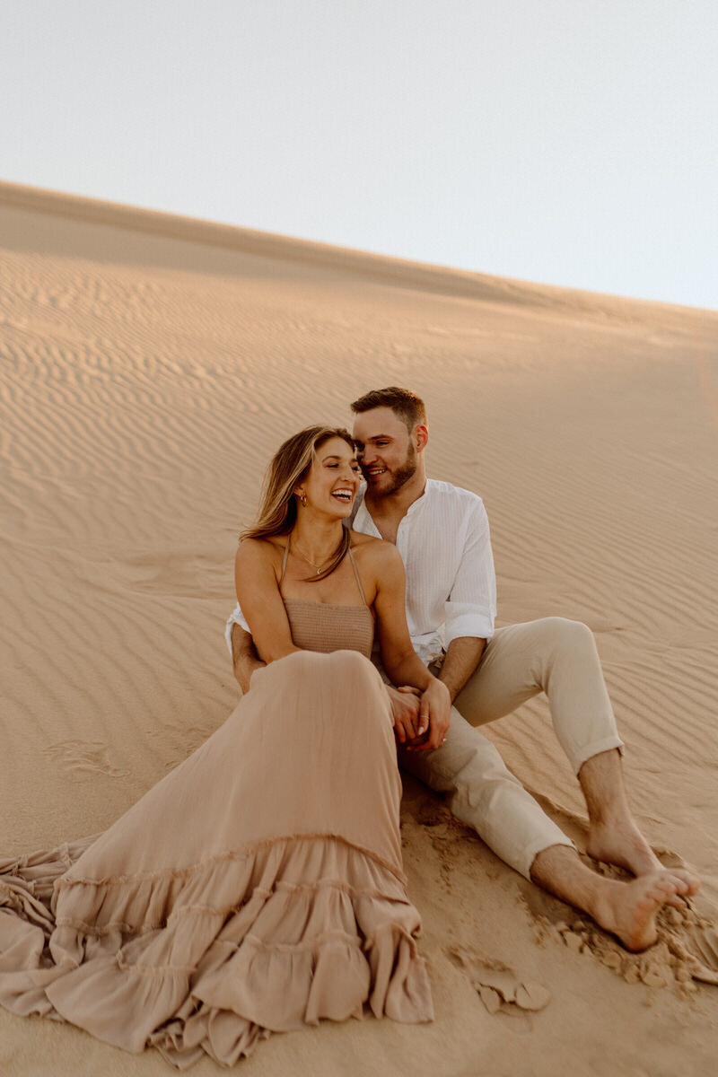 couple in the sand dunes