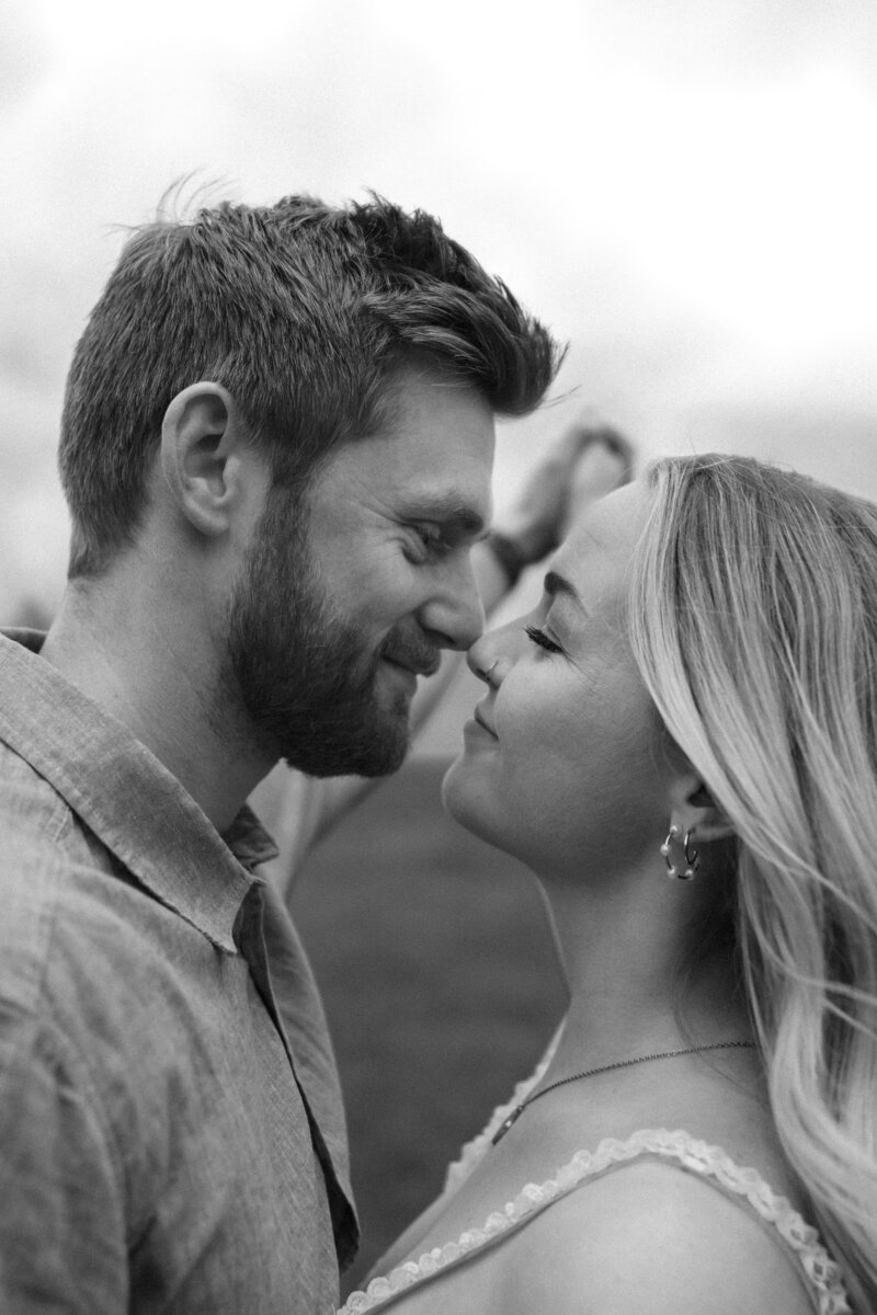 Couple celebrating their engagement, captured in a joyful and intimate moment as they share their love and excitement for their future together.