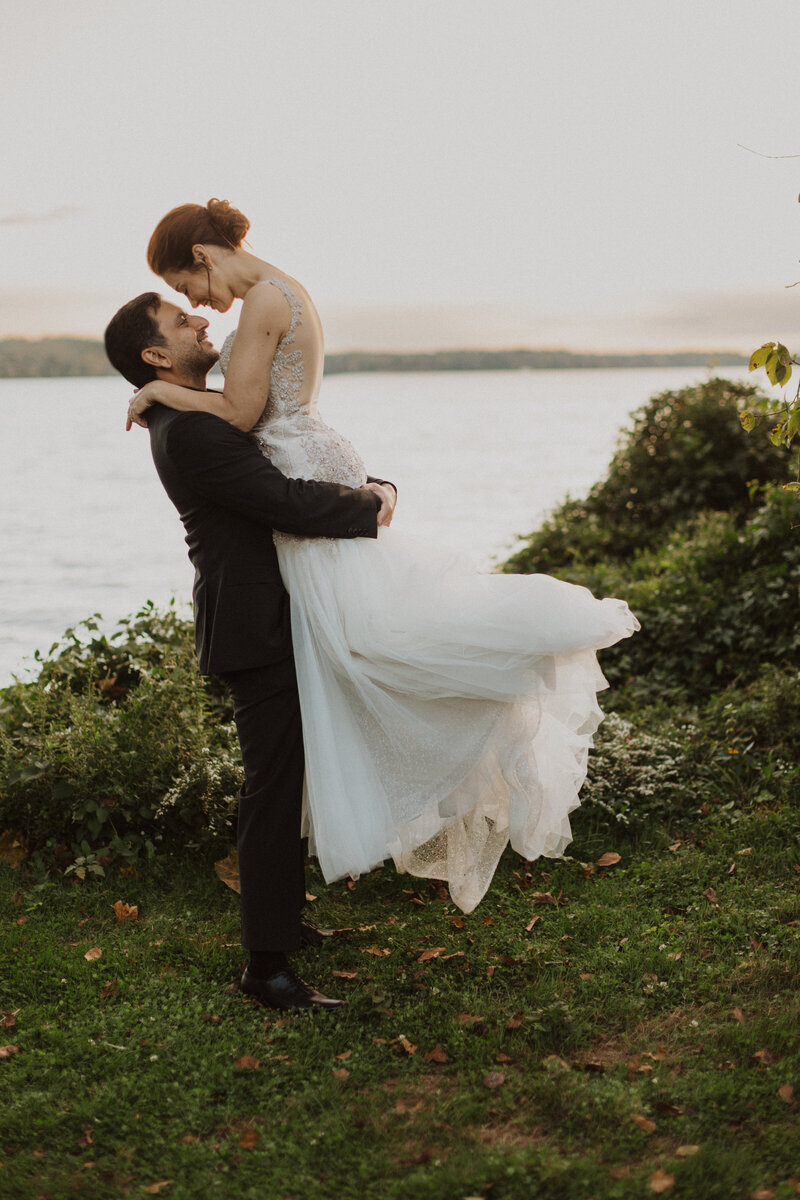 Man Lifts Bride in Outdoor DC Wedding Photo