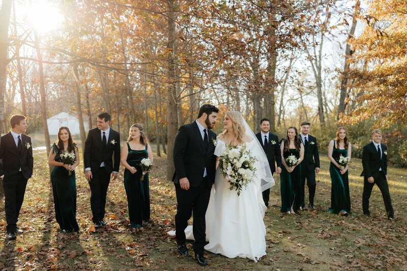 The wedding party walking in a row.