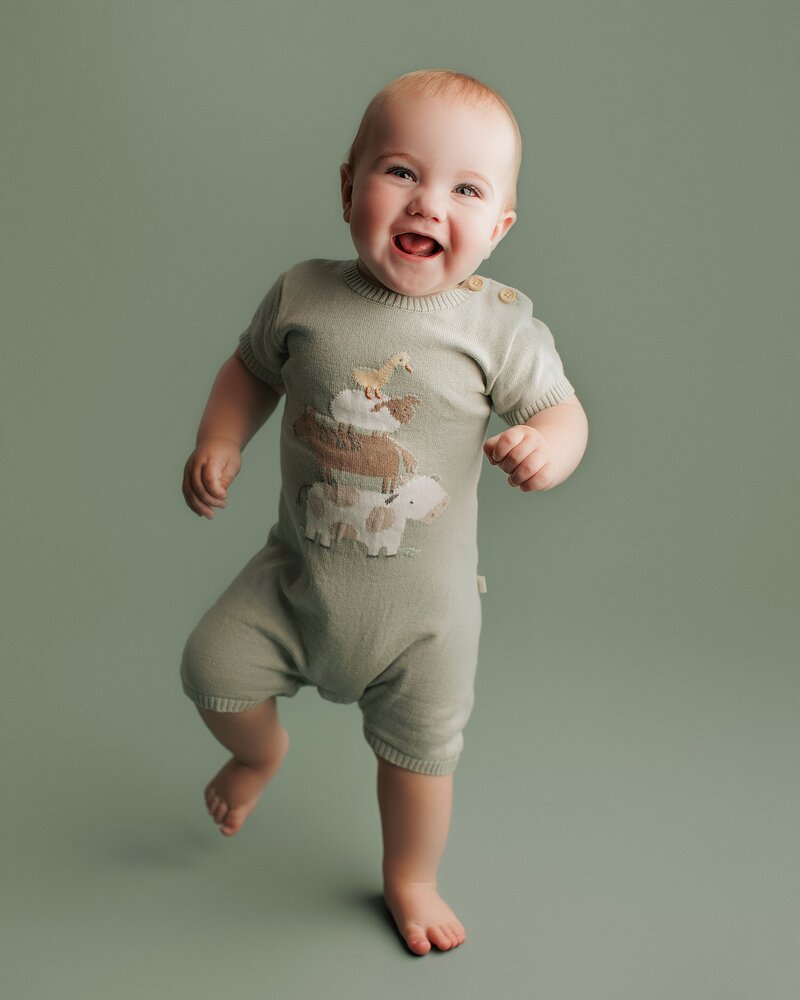 Baby giving playful side-eye in a fun studio session