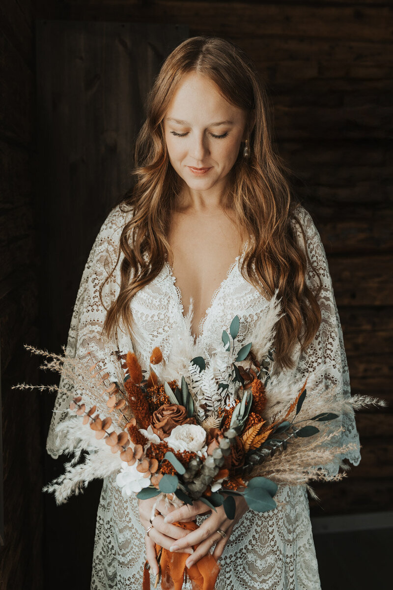 Wedding boho bride with large wedding flowers