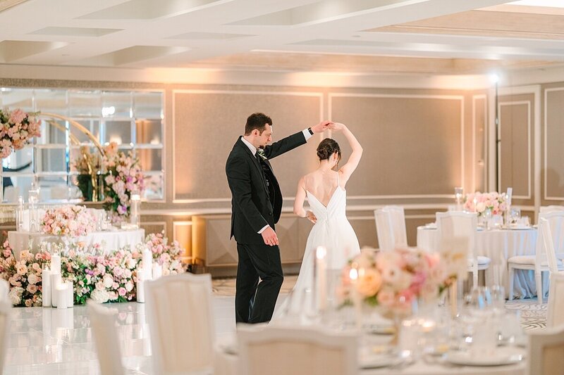 Bride and groom twirling during their first dance at their wedding reception at Surf and Sand Hotel in Laguna Beach filmed by Sherr Weddings.