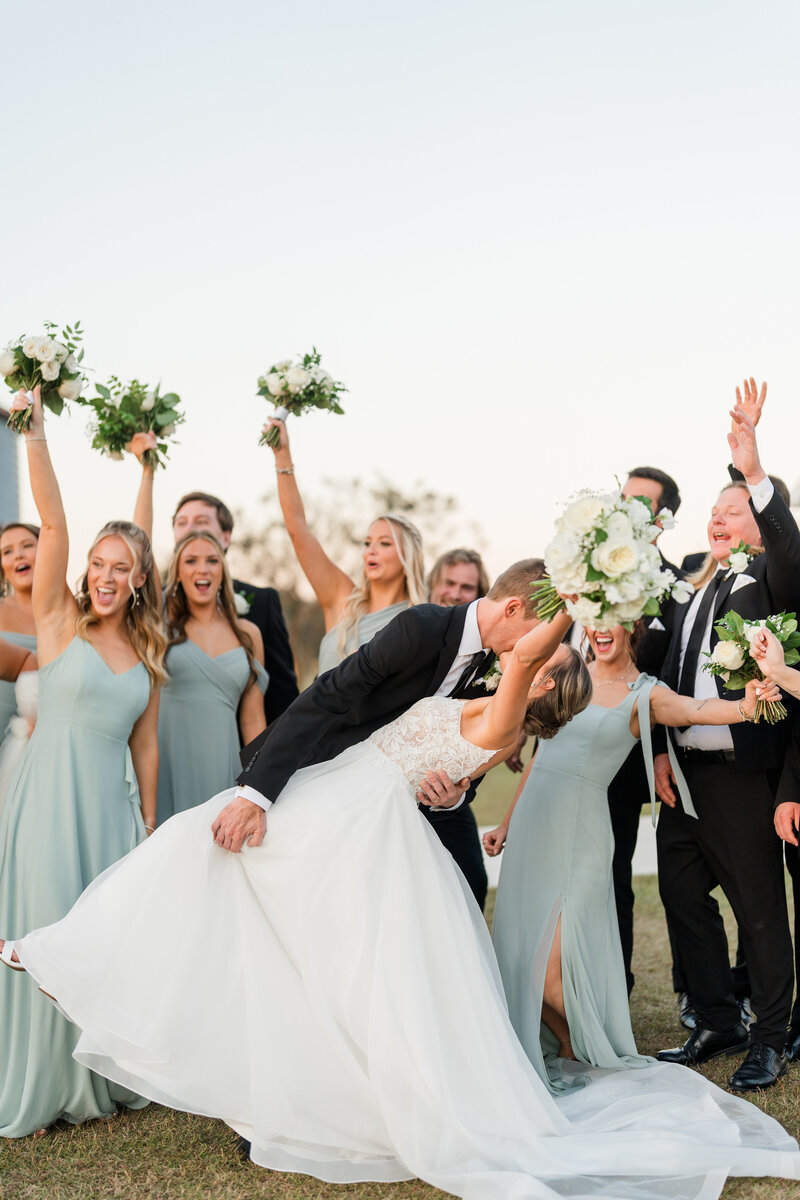 Newlyweds share a kiss during newly wed portraits