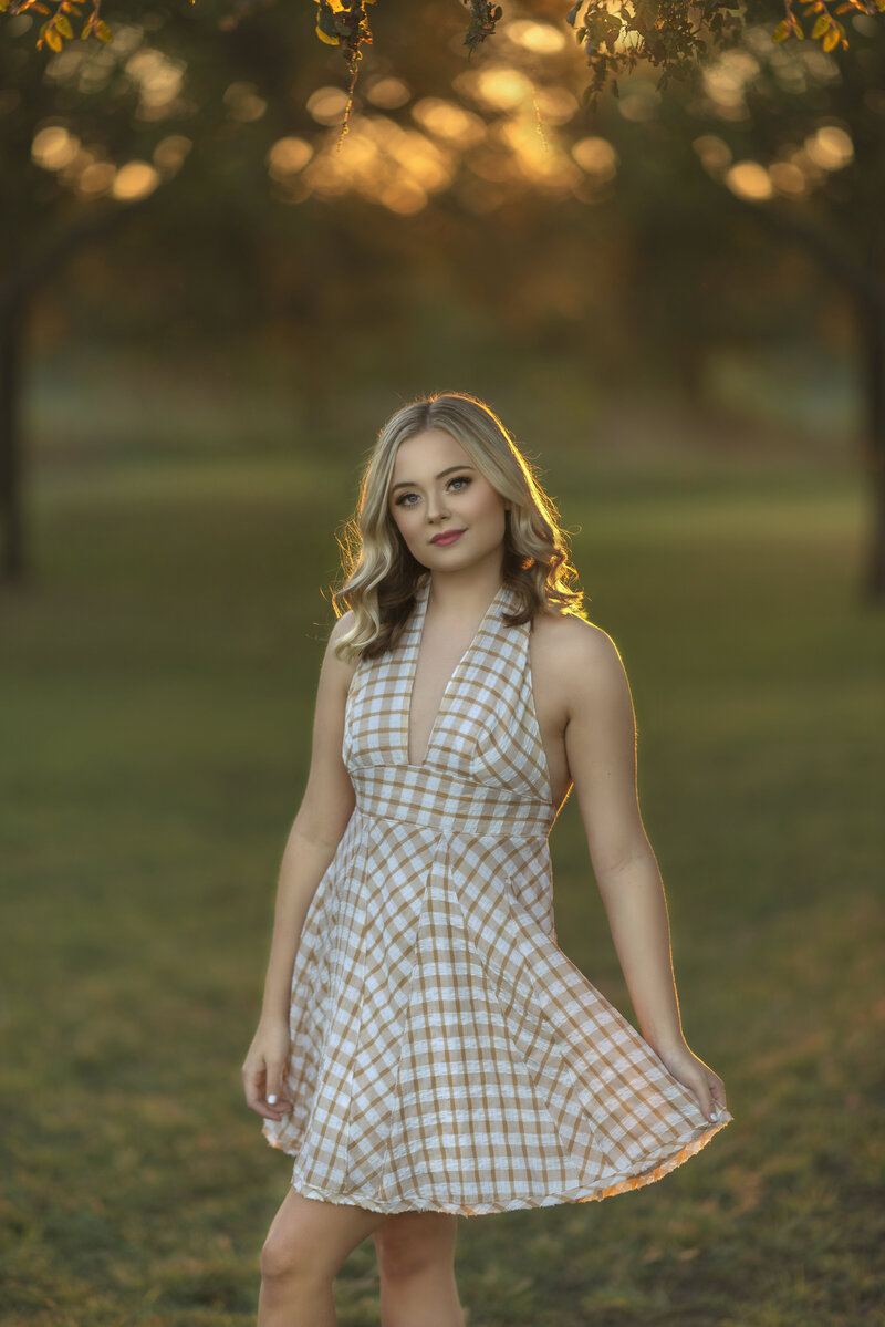 high school senior girl in the fall for senior photo shoot