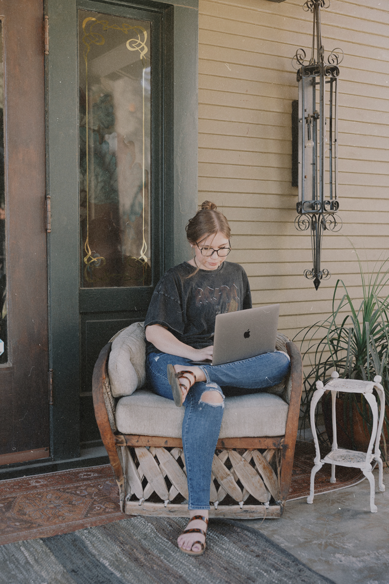 Copywriting on my laptop for my clients on their way to multi six-figures!