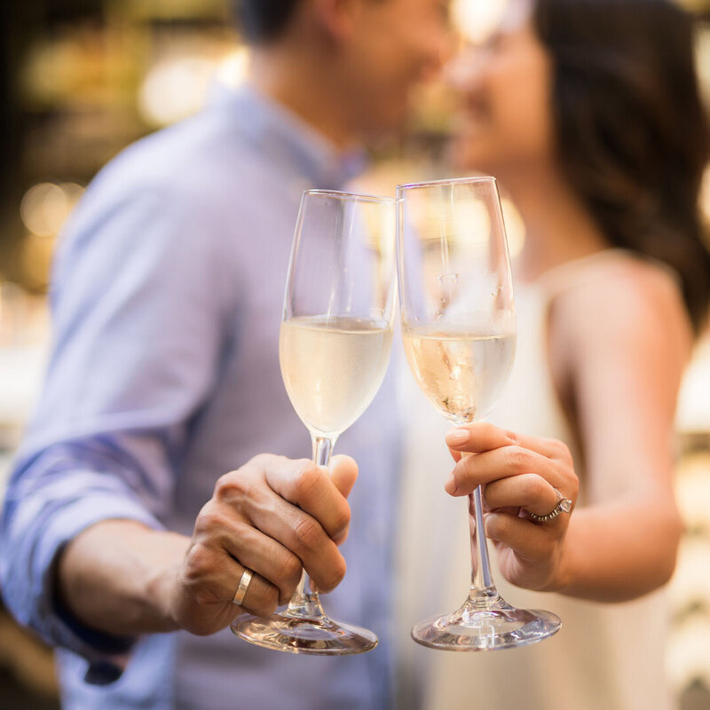 couple celebrating with glass of champenge