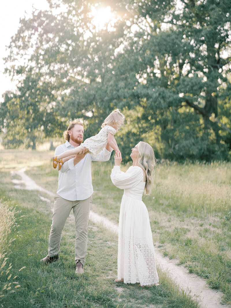 Mother catching daughter as dad sways her