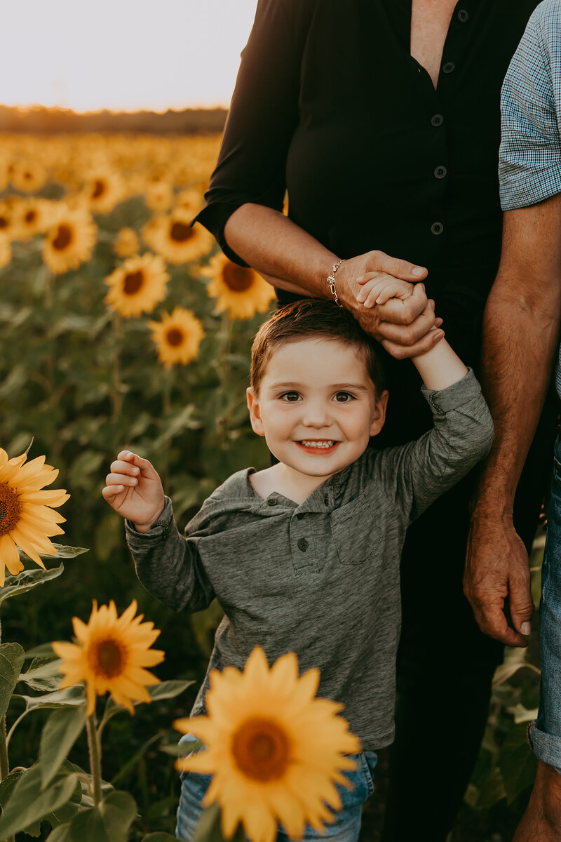 son-holding-mothers-hand