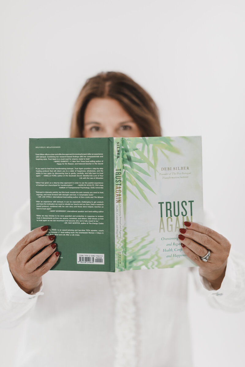 Coach Lisa holding Dr. Debi Silber"s book