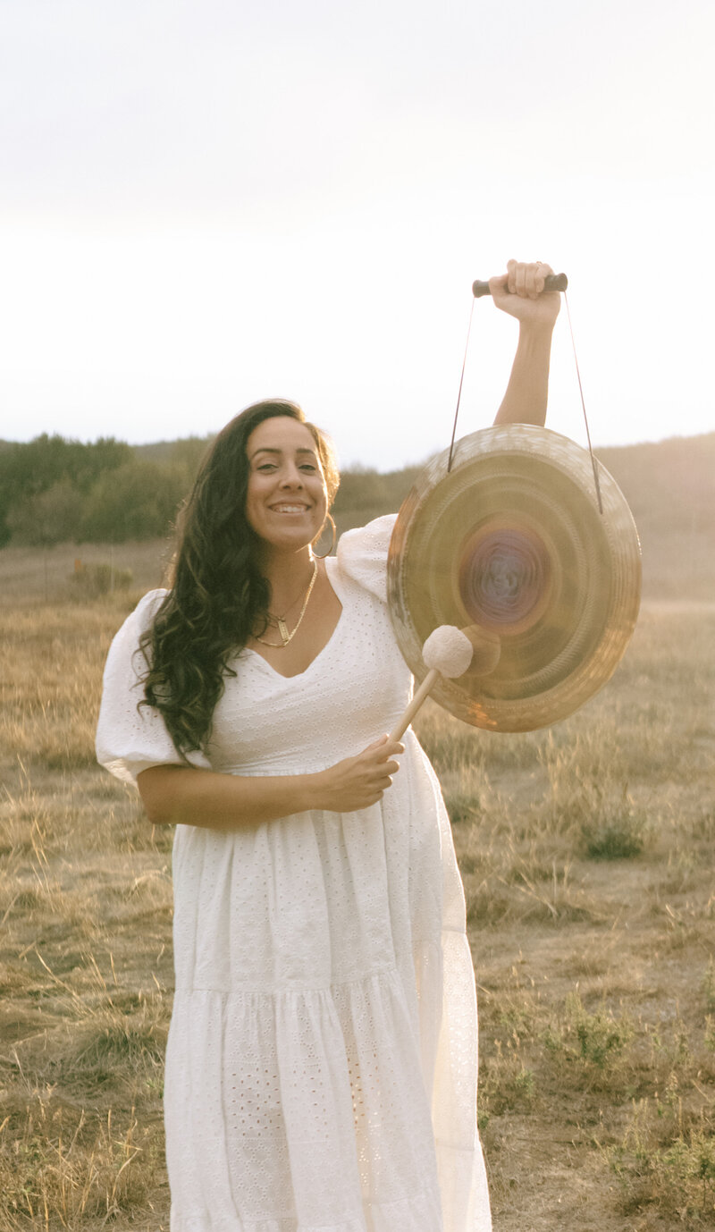 Traveling sound healer, Jazmine Amelia, visits the Glastonbury Tor after a Sound Bath