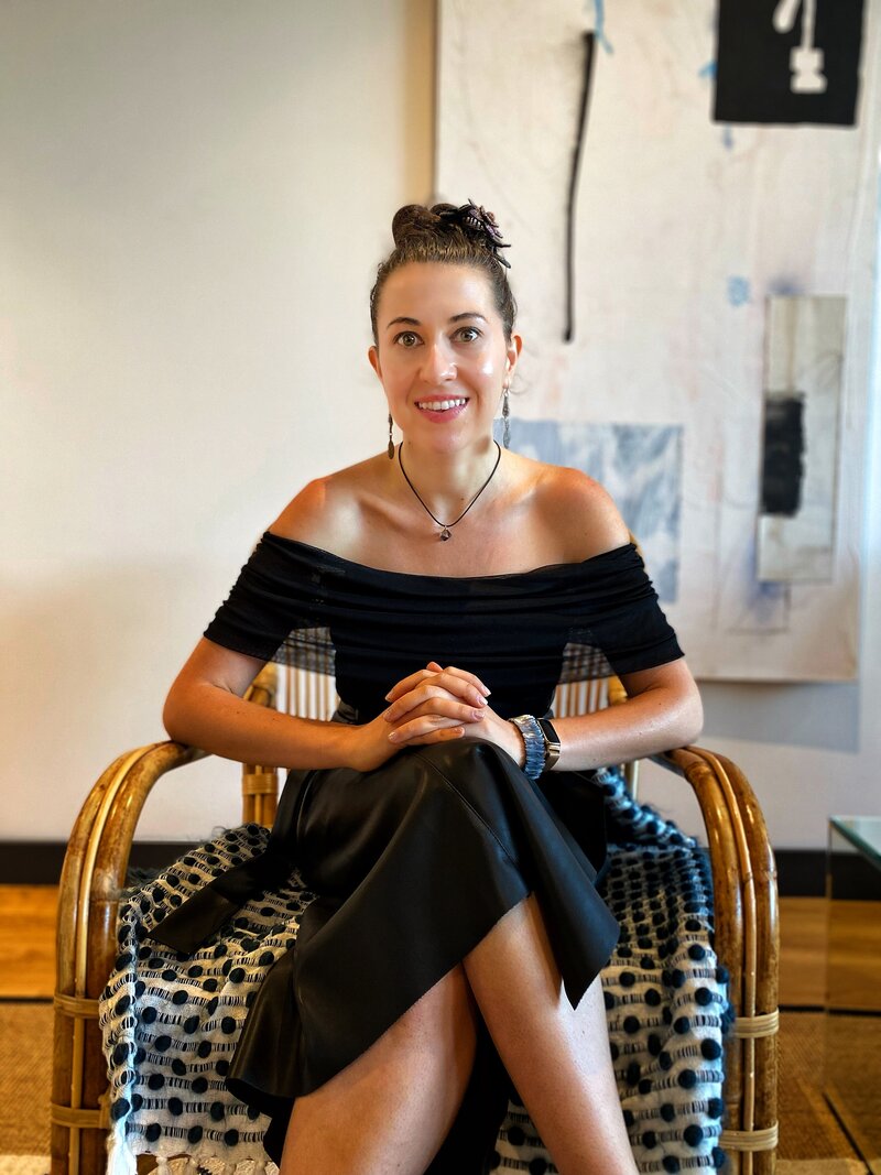 Life coach Ana-Maria Georgieva sitting in a patterned chair