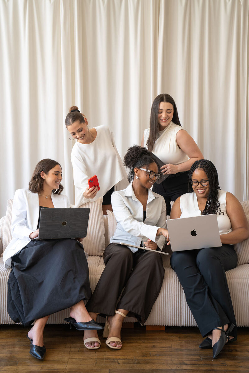 women working together at a desk
