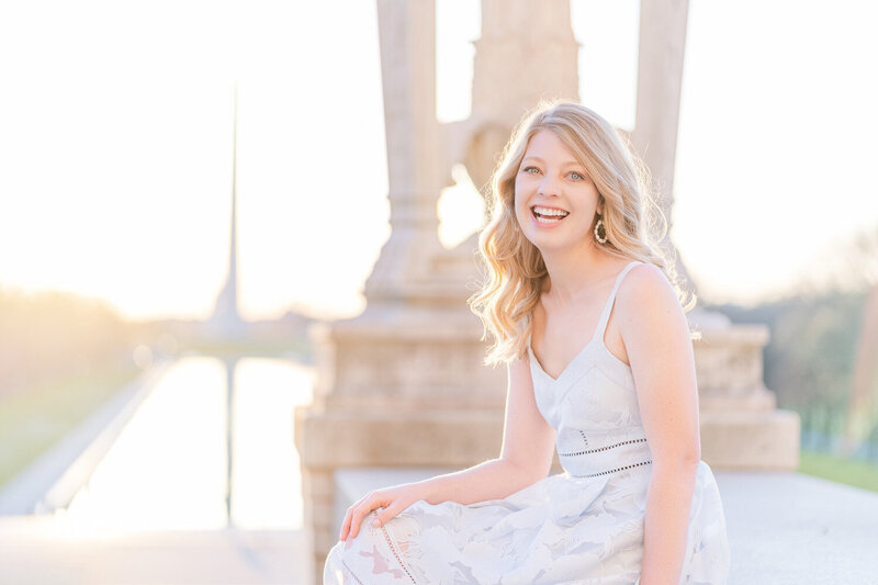 college girl during senior photos with the Reflecting Pool at the background