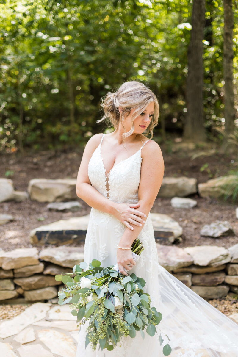 Bride carrying eucalyptus  bouquet