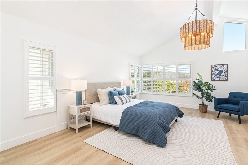 coastal primary bedroom home staging