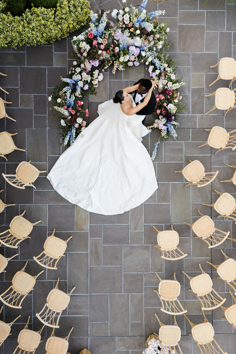 Drone shot of bride and groom dancing at their ceremony site taken by the Cannons, wedding photographers in detroit