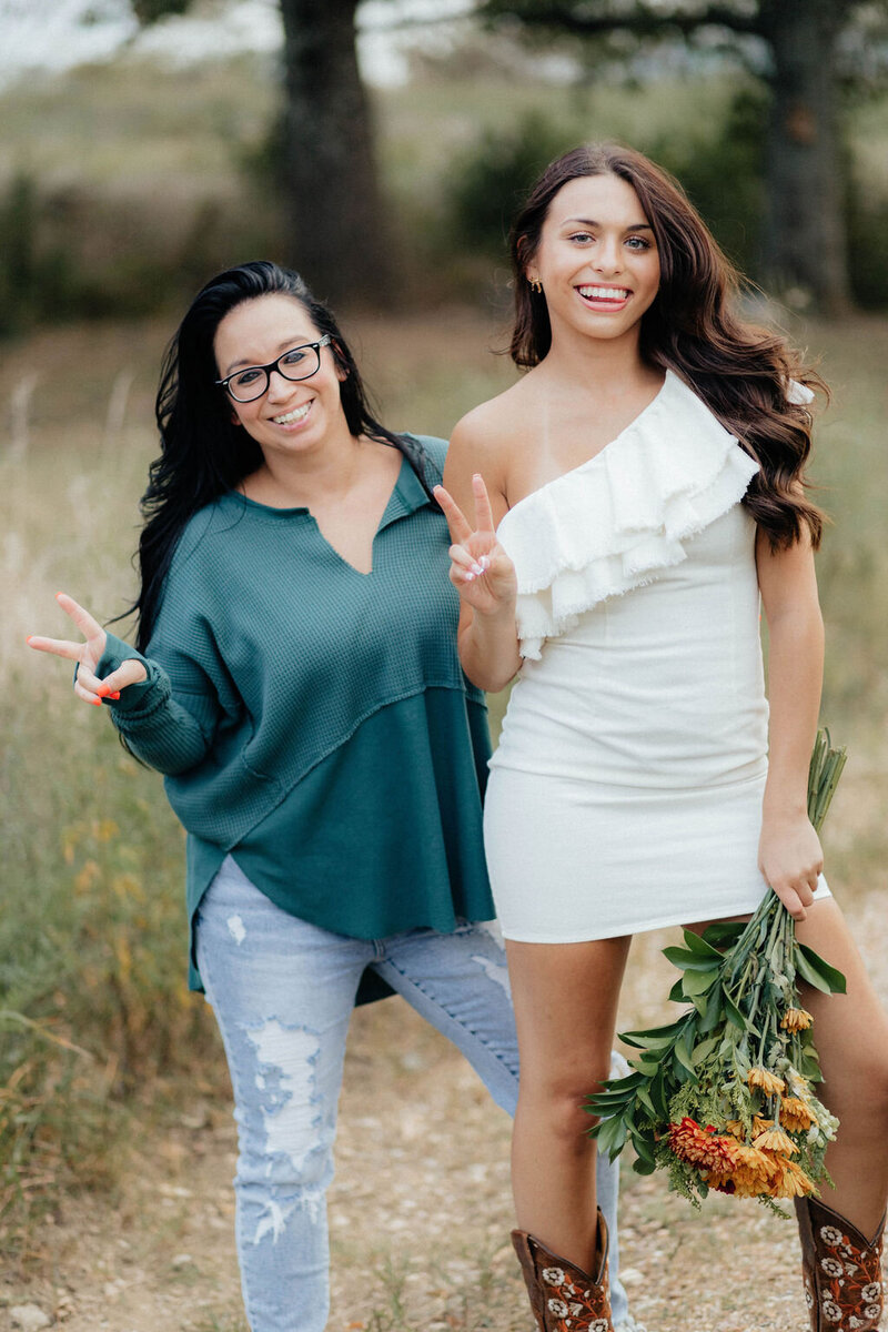 girl and mom posing together