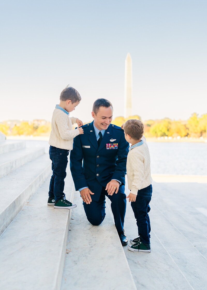 Twin boys pinning rank on man in Washington, D.C. for Melissa Sheridan Photography, military photographer