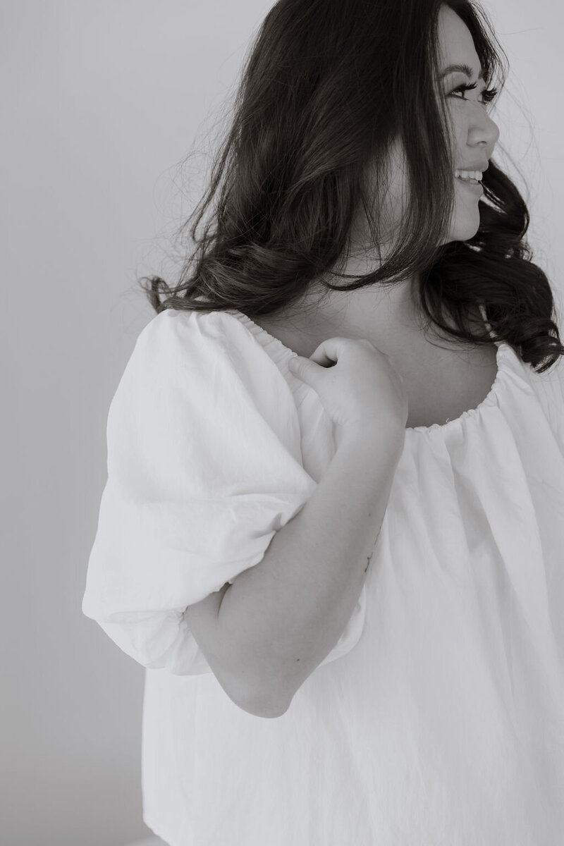 Woman in white top