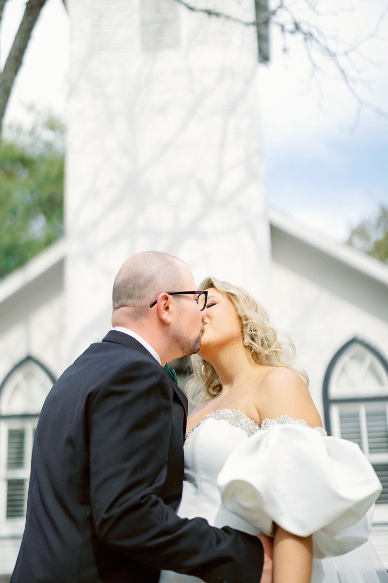 bride and groom kissing