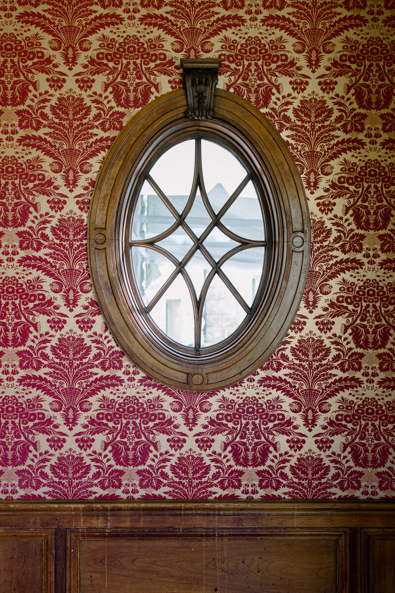 Tiffany Longeway Photography captures an exquisite and historic detail at The Fairmont San Francisco in San Francisco, California. The intricate woodwork and rich wallpaper reflect the luxurious and timeless elegance of this renowned venue, ideal for couples seeking a sophisticated and historic setting for their wedding celebration.
