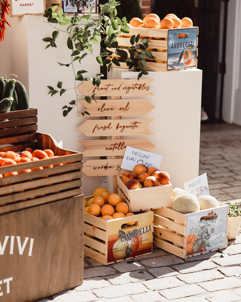 Event display featuring oranges and signage