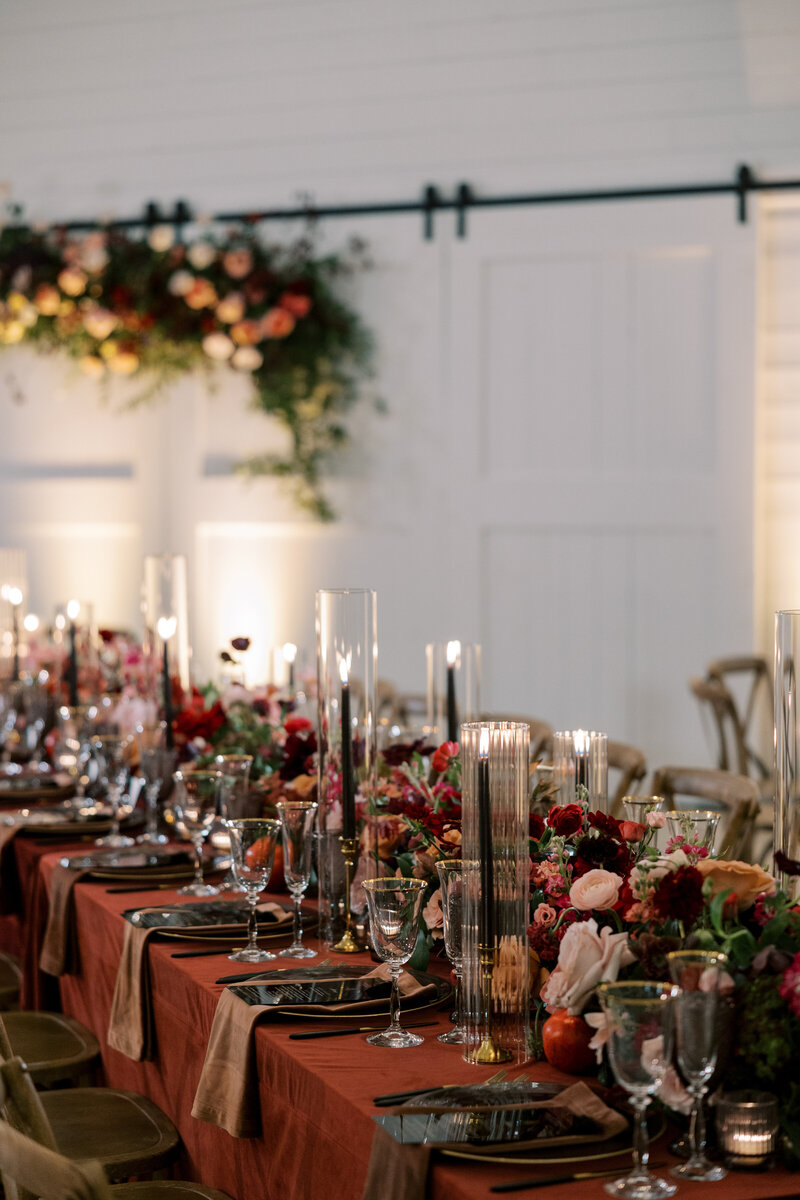 Wedding reception with white chairs and flowers