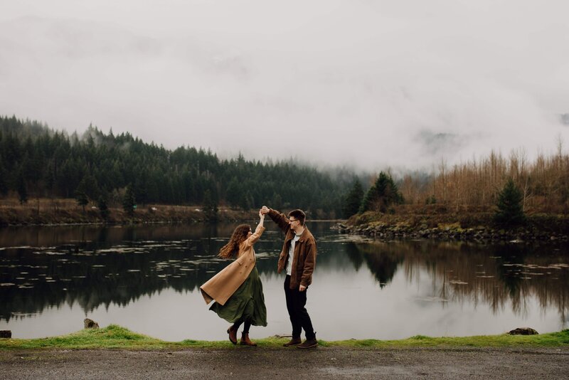 man kisses woman in forest