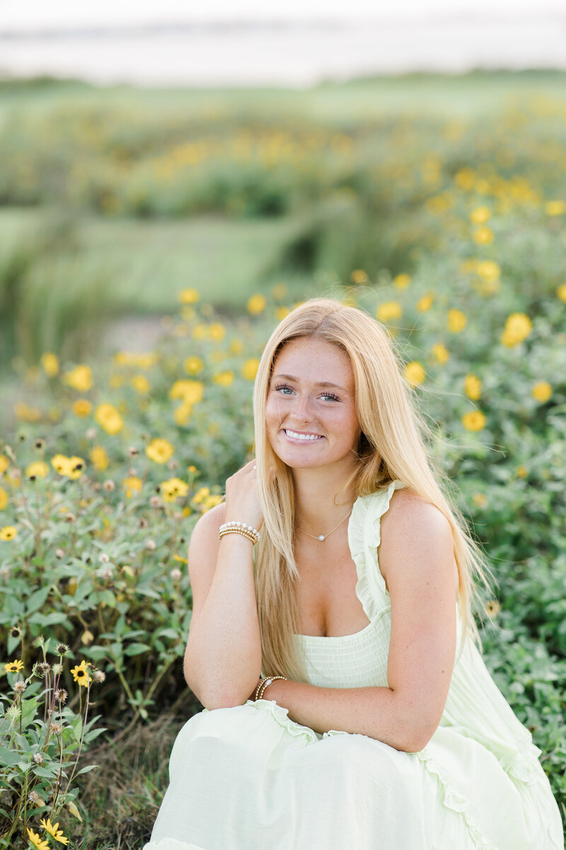 Senior girl by flowers. Tampa florida senior photographer. 