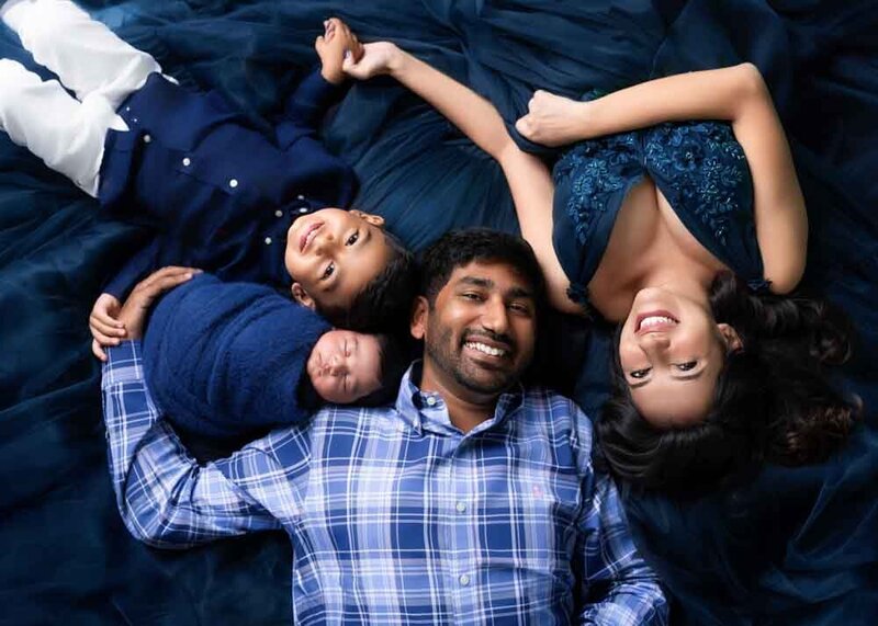 family-of-five-lying-down-overhead