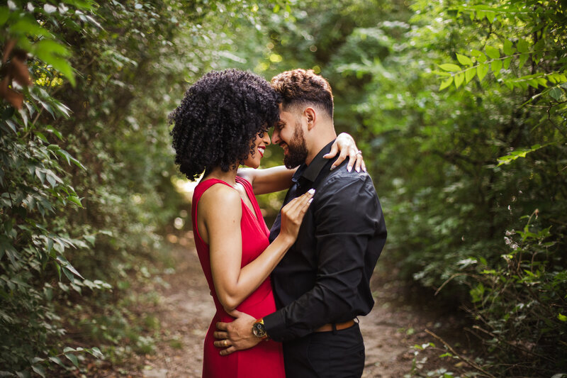 couple hugging during outdoor adventure engagement session