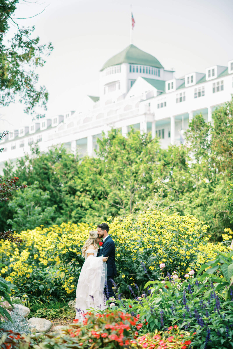 Bride and groom first look photography in garden at The Grand Hotel in Mackinac Island