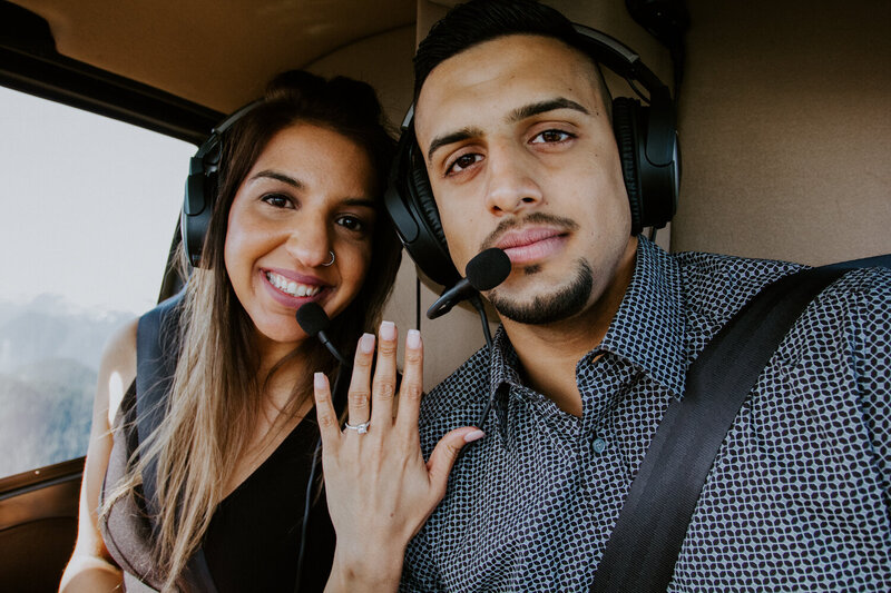 Couple with ring in a helicopter