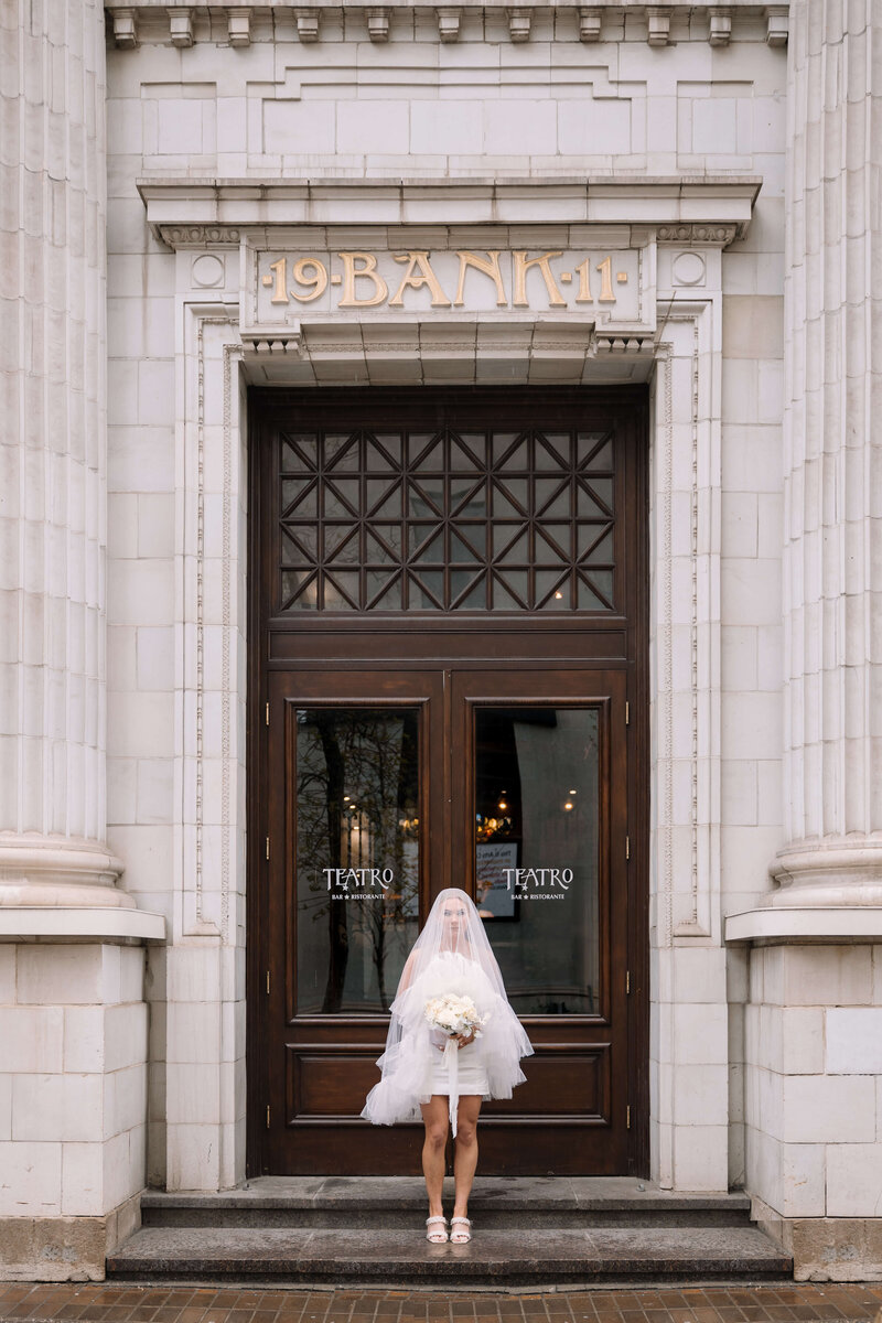 bride-standing-outside-courthouse-nika-helgeson-photography