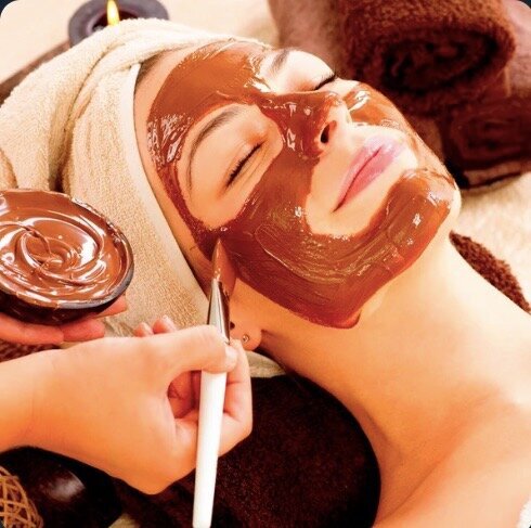 A skincare specialist at Mei Spa providing a rejuvenating facial treatment using natural products.