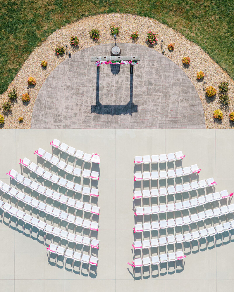 bride and groom walking down the aisle after getting married with a white alter behind them. A venue in Roanoke Virginia.