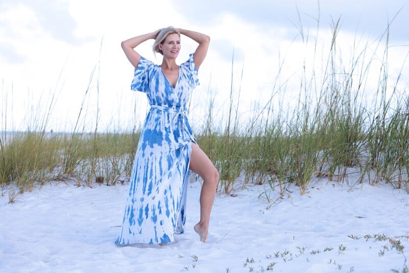barb hawken on the beach in a blue dress