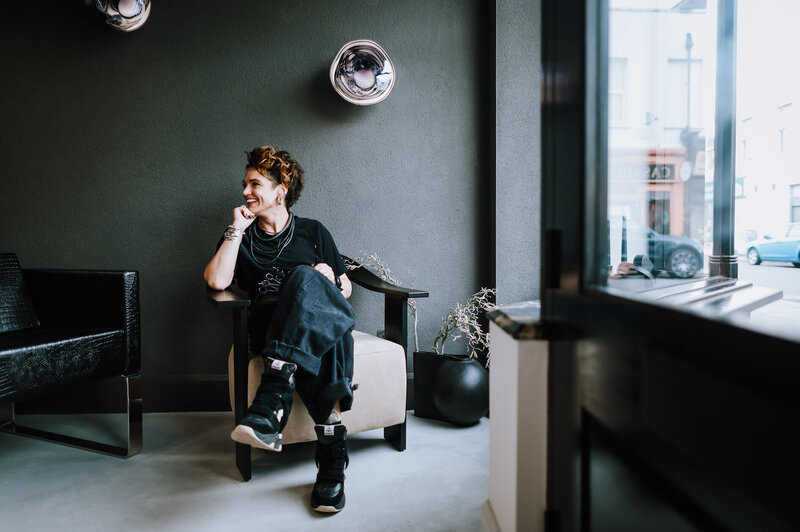  Image of Joni sitting in a chair in the new salon