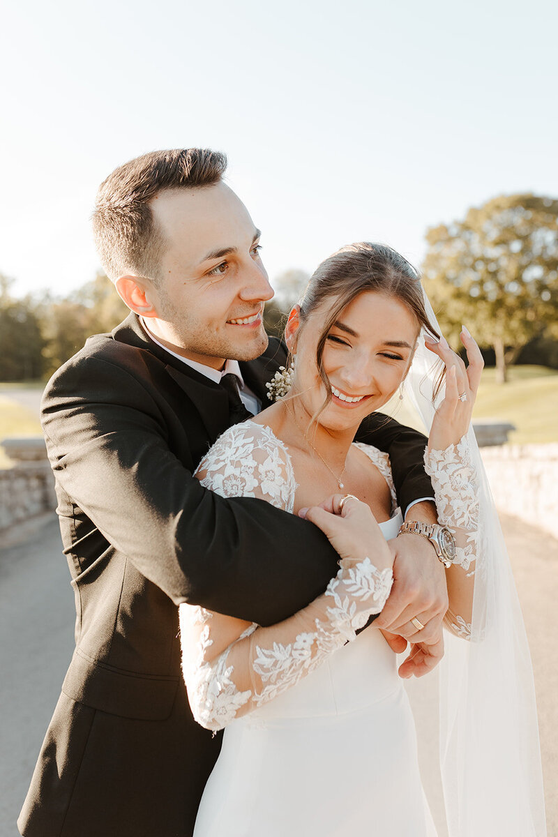 man hugging woman from behind
