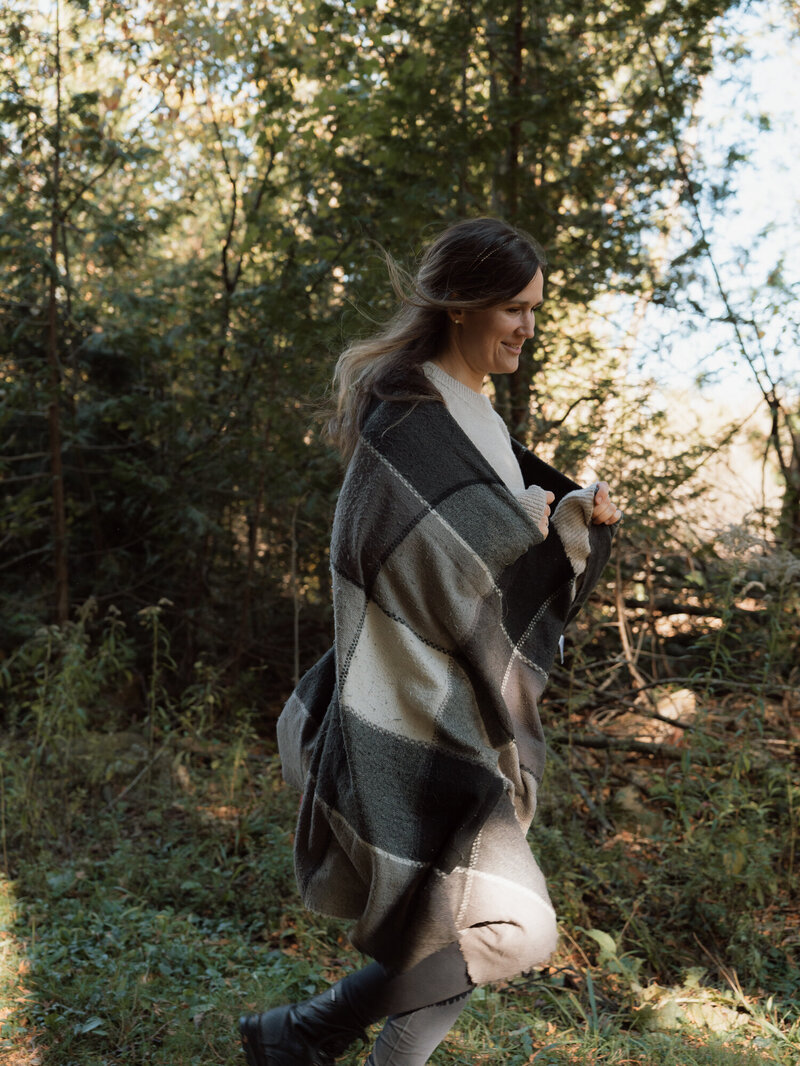 Jasmin posing playfully in front of a mirror