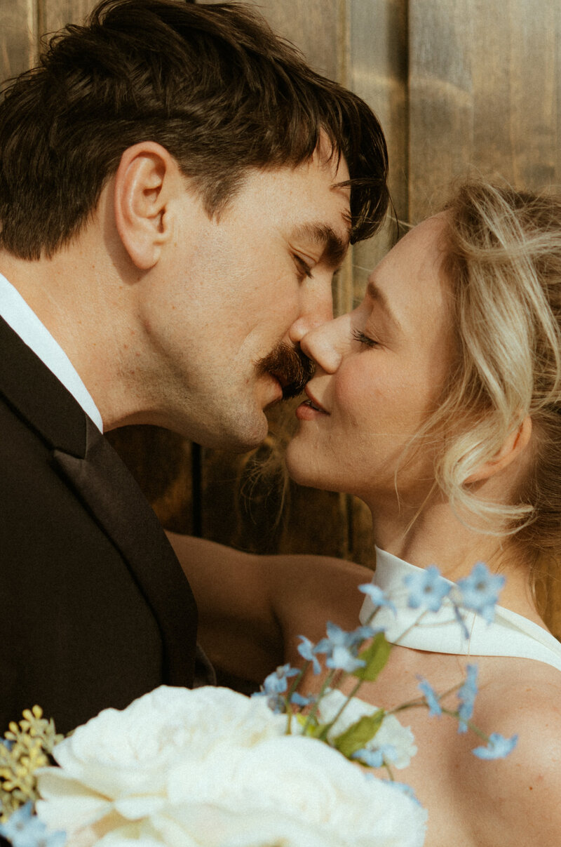 bride and groom kissing